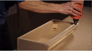 Man applying Pyaracol Furniture Adhesive